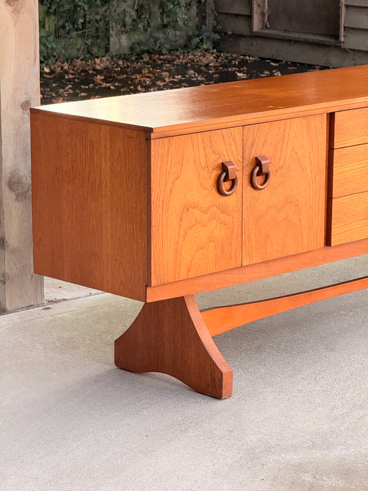 Beautility Teak Sideboard, Mid-Century Masterpiece with Sculptural Trestle Base, 1960s British Craftsmanship