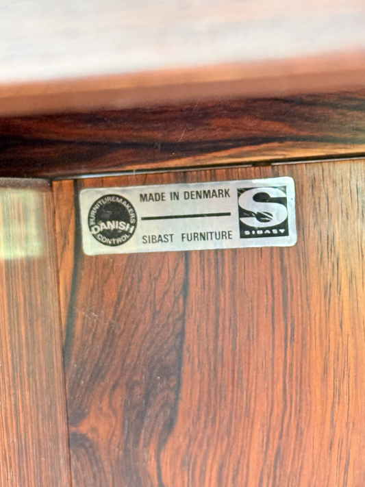 Close-up of Sibast Furniture 'Made in Denmark' label on rosewood
