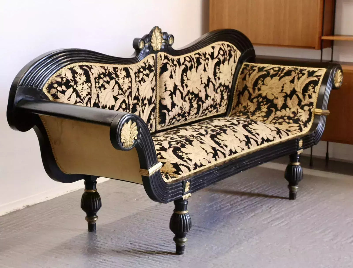 Empire Regency ebonised double-ended couch, three-quarter view from the right
