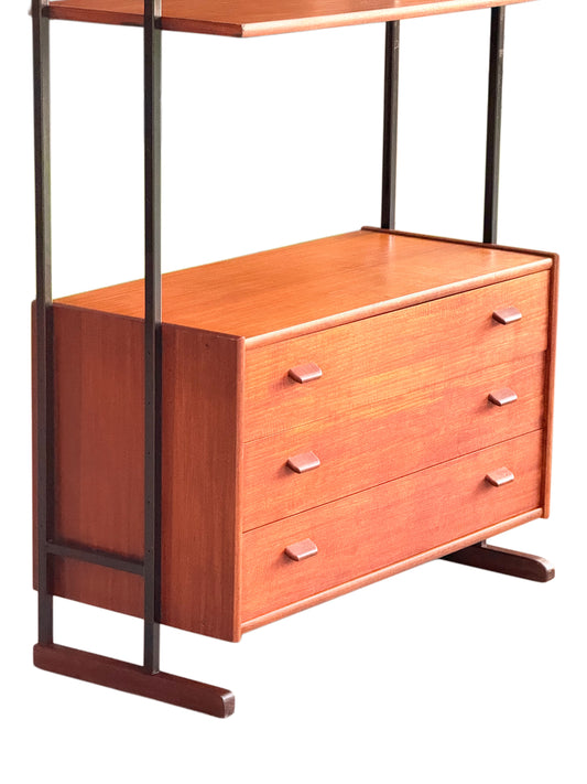 Teak chest of three drawers with angled teak pulls on black steel ladder frames and teak sledge feet