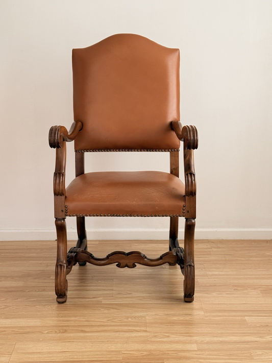 Spanish Baroque Revival carved wood and leather armchair, front view