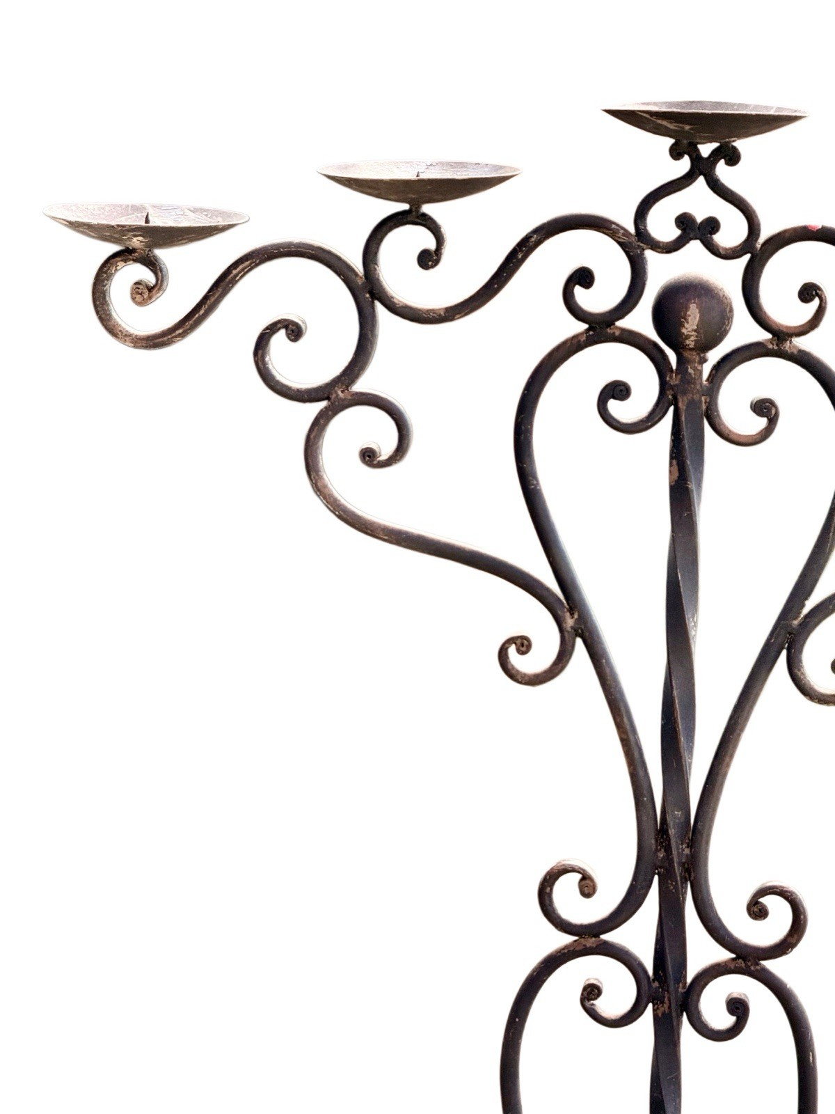 Wrought iron candelabra, close-up of drip pans and scrolled arms, left side