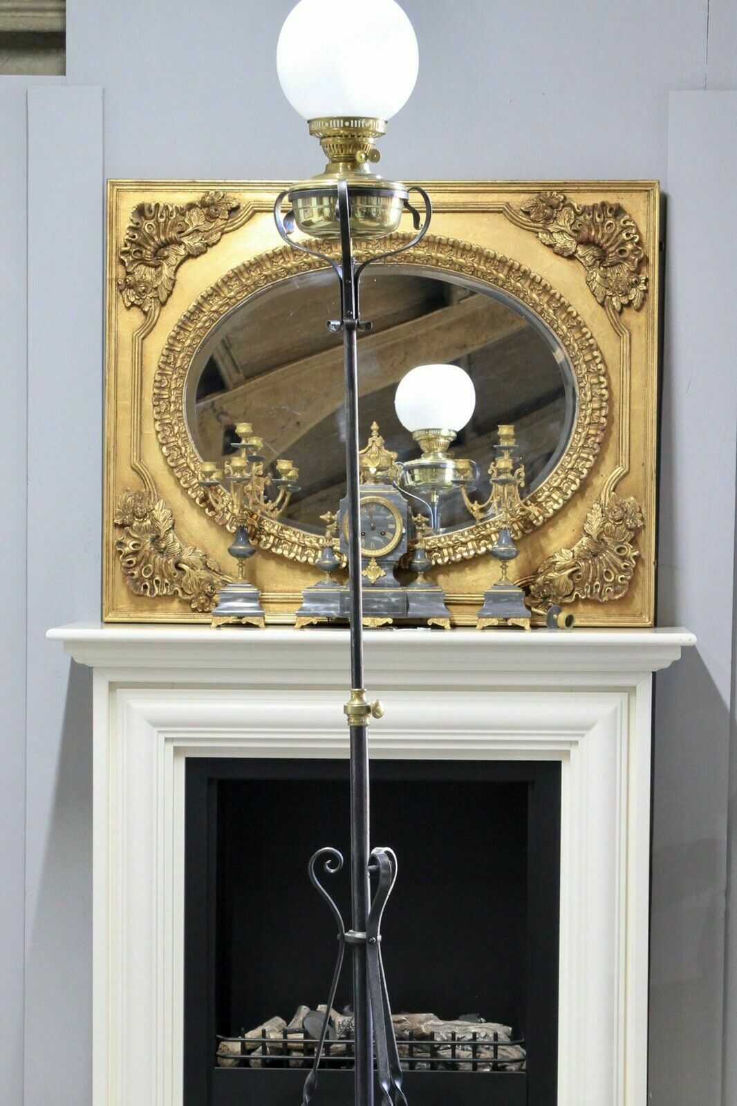 Wrought iron rise and fall standard lamp, upper section raised