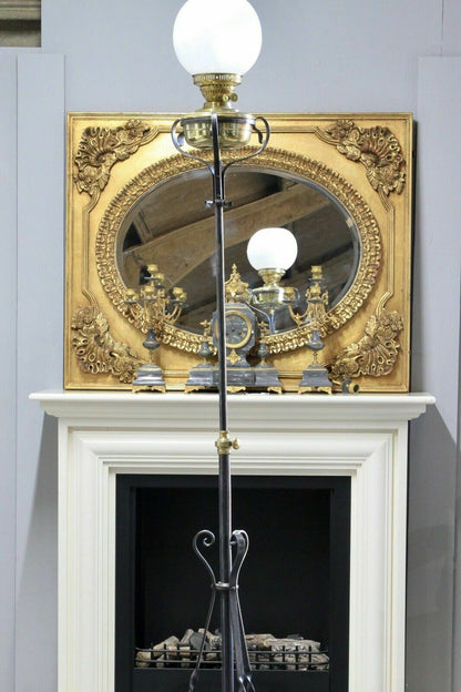 Wrought iron rise and fall standard lamp, upper section raised