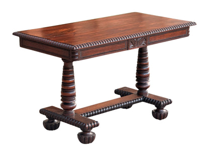 Anglo-Indian rosewood library centre table, front three-quarter view showing the pearl-beaded frieze and gadrooned stretcher