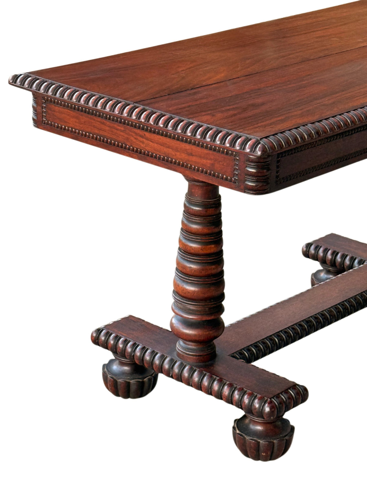 Close-up of the rosewood table's gadrooned edge, turned column and gadrooned platform base with bun feet