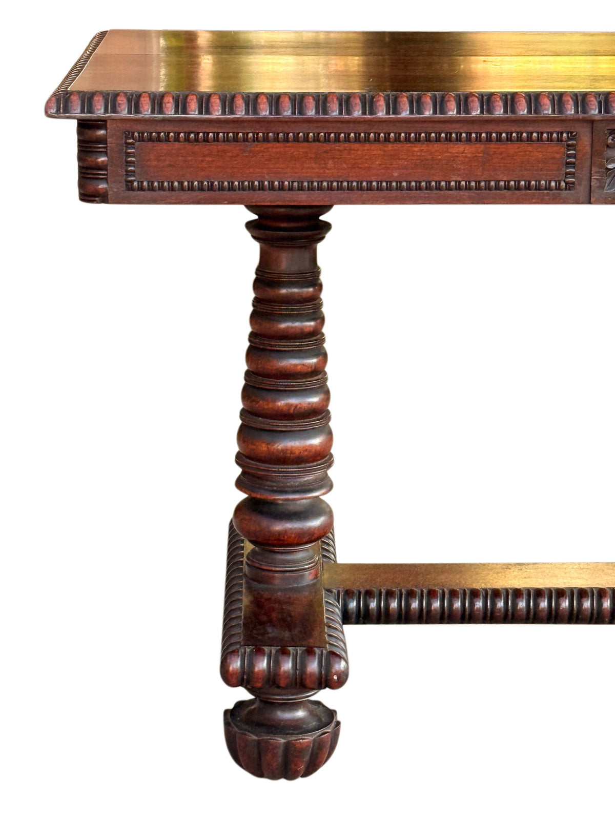 Rosewood library table end view: turned column support and pearl-beaded frieze