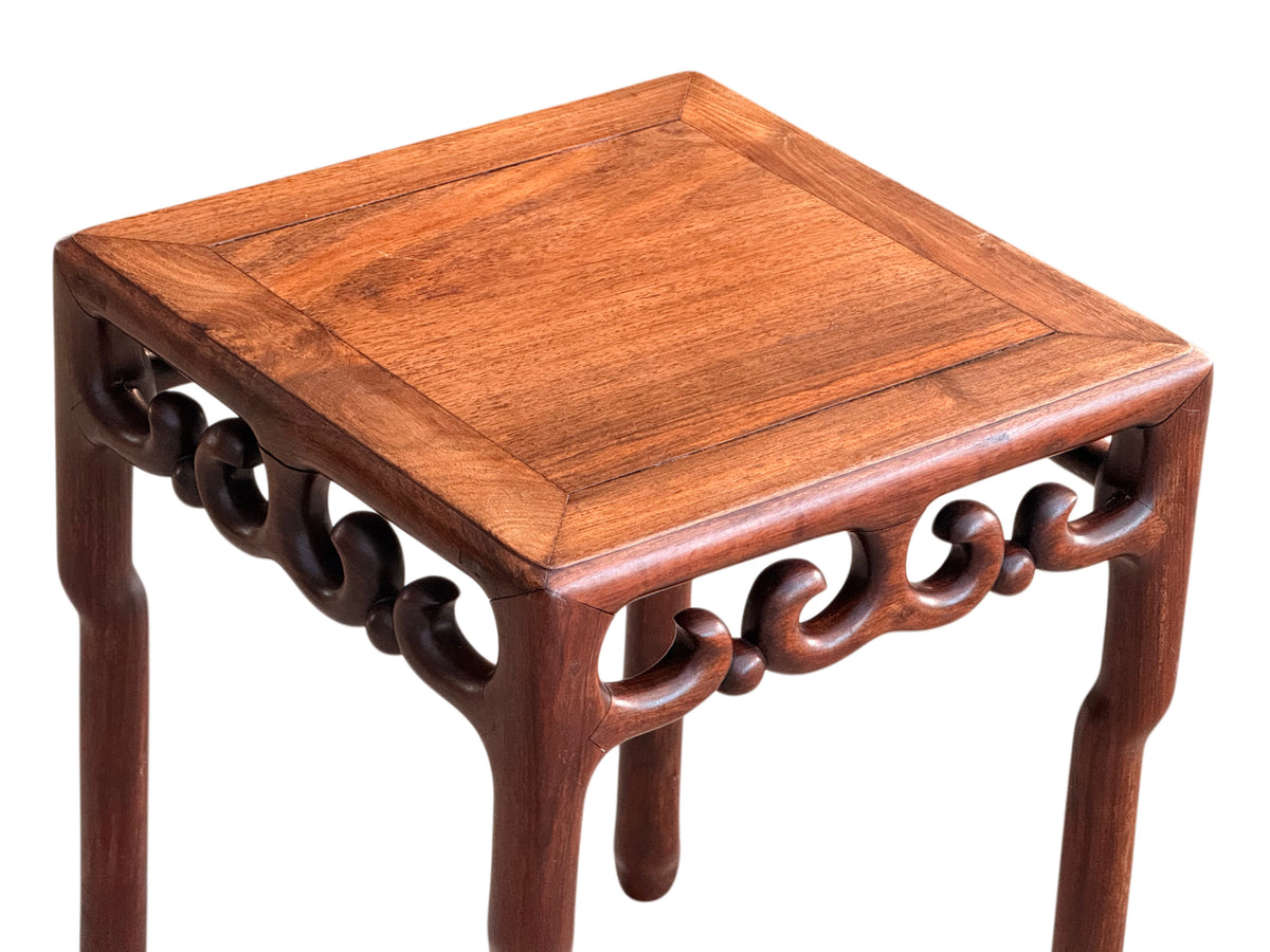 Three-quarter view from above of the rosewood lamp table
