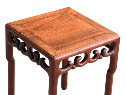 Three-quarter view from above of the rosewood lamp table
