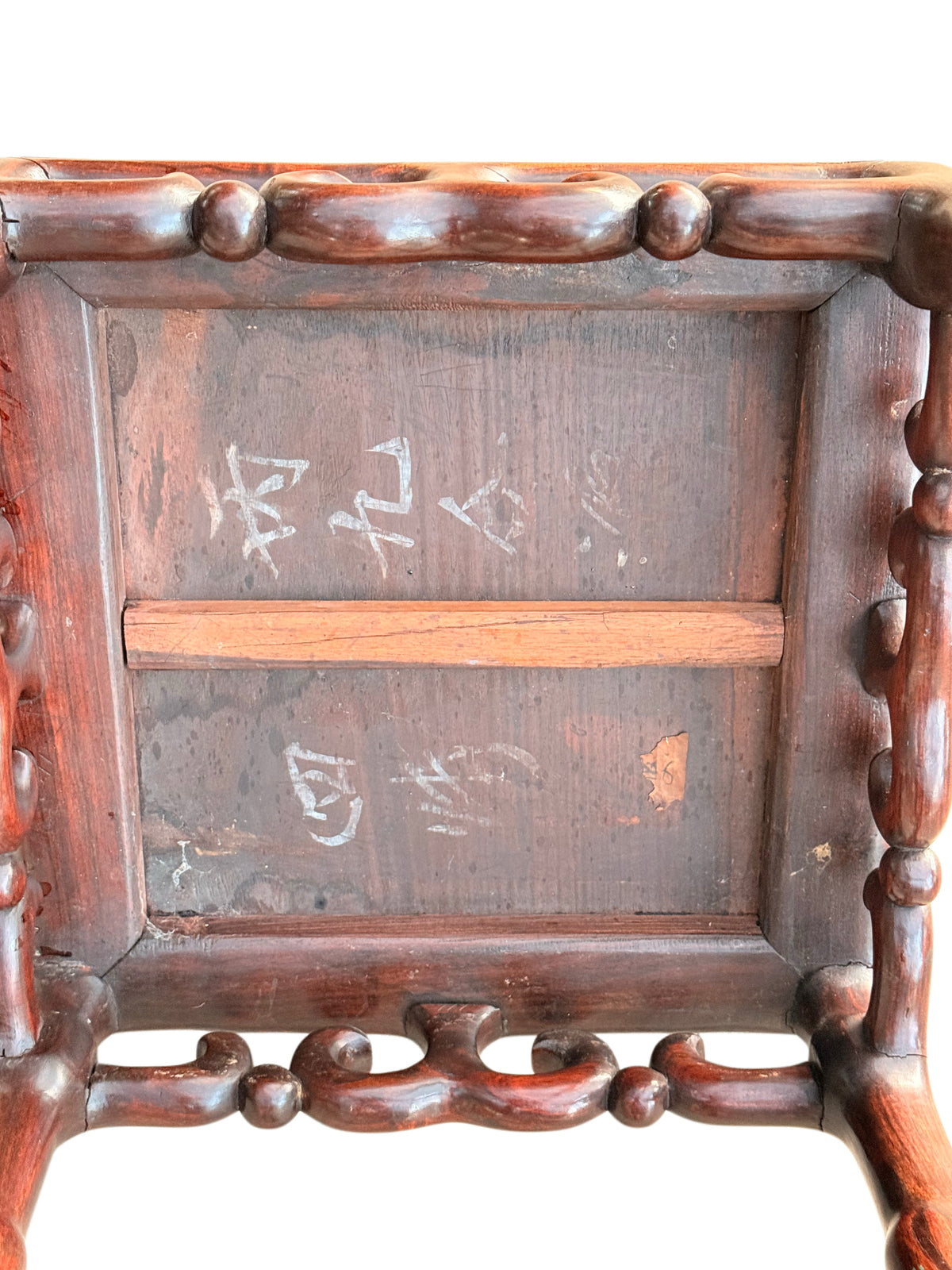 Underside with cross brace, old Chinese characters in white and label remnant