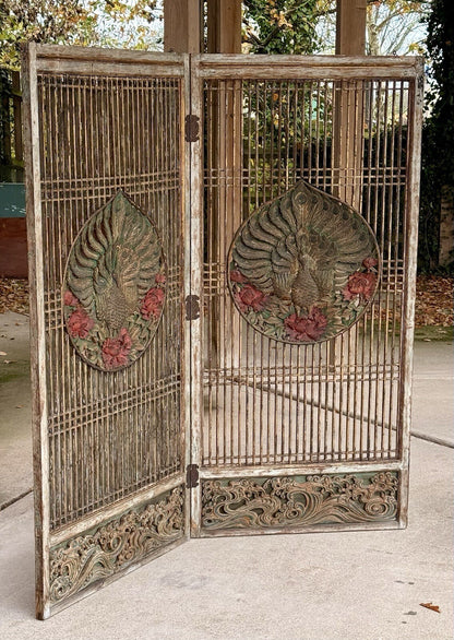 Two-panel carved peacock screen, slightly folded front view