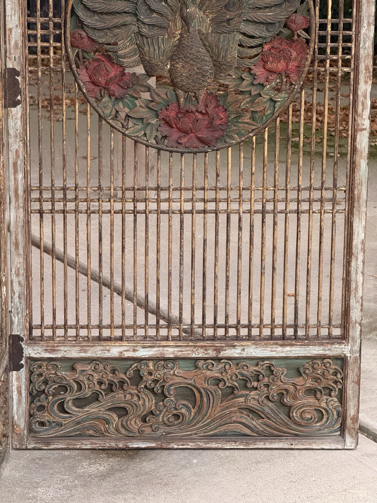 Lattice screen panel with peacock medallion and carved wave base