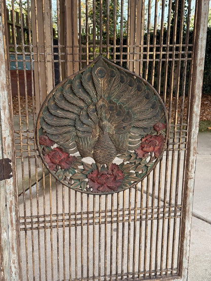 Close-up of gilded peacock and red peonies, carved screen medallion