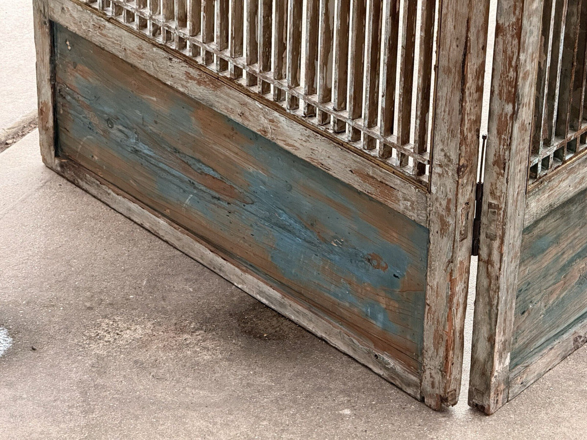 Reverse of lattice screen, blue painted base panels and hinge