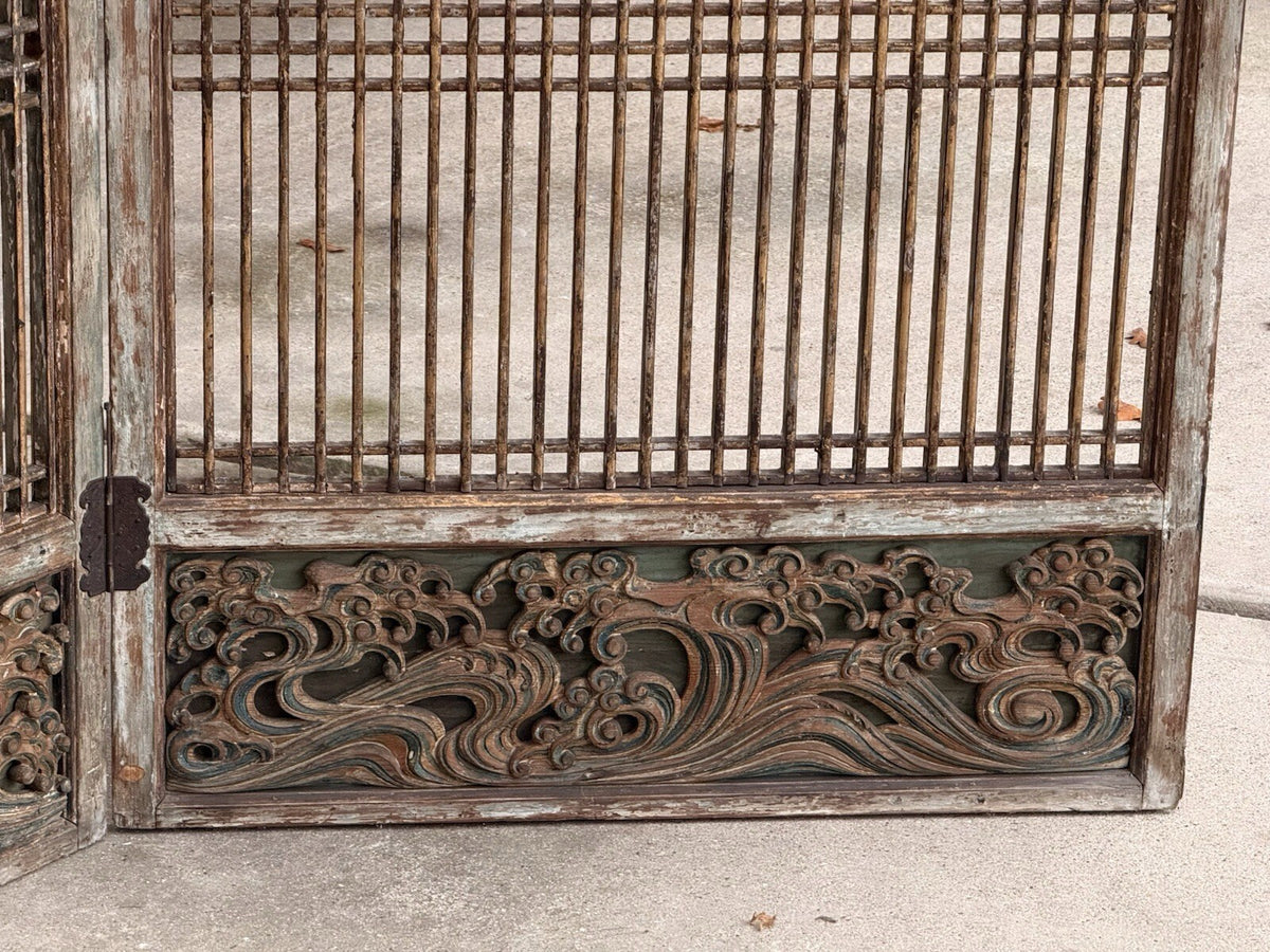 Carved wood lattice screen, detail of hinged base panel with wave carving