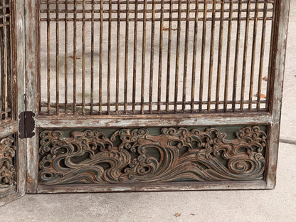 Carved wood lattice screen, detail of hinged base panel with wave carving