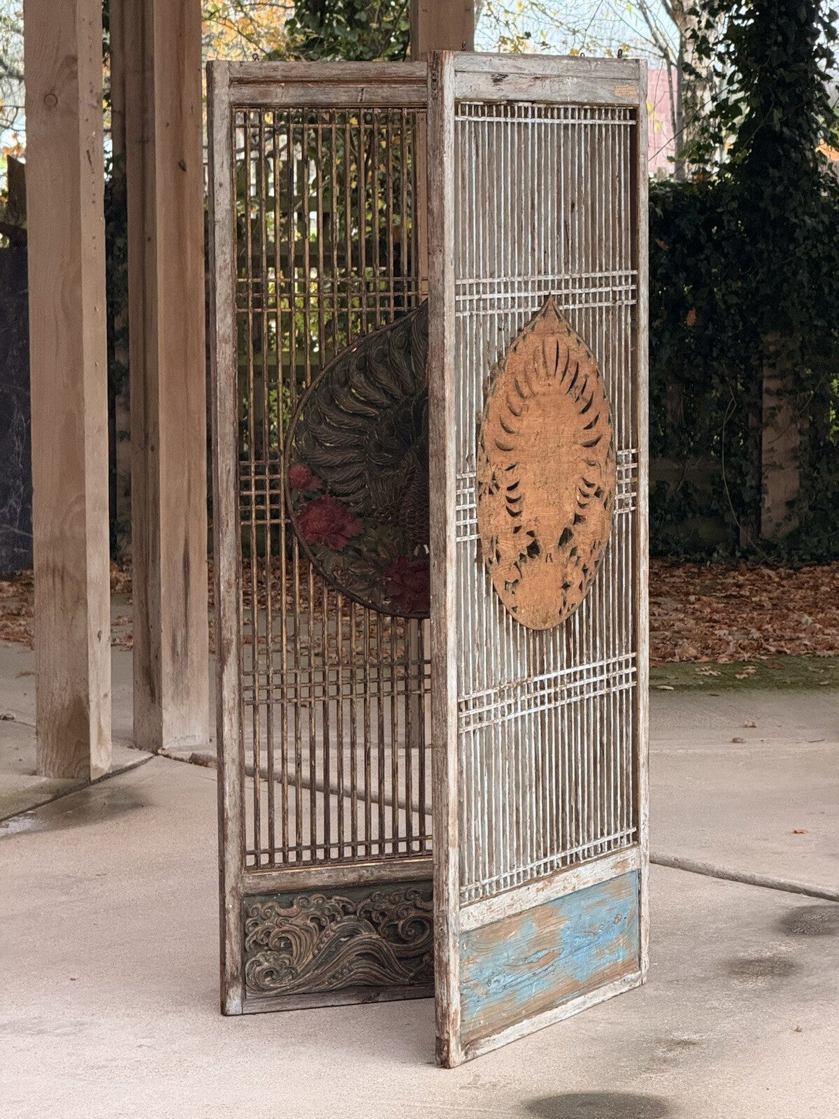 Two-panel lattice screen folded, showing front and reverse medallions