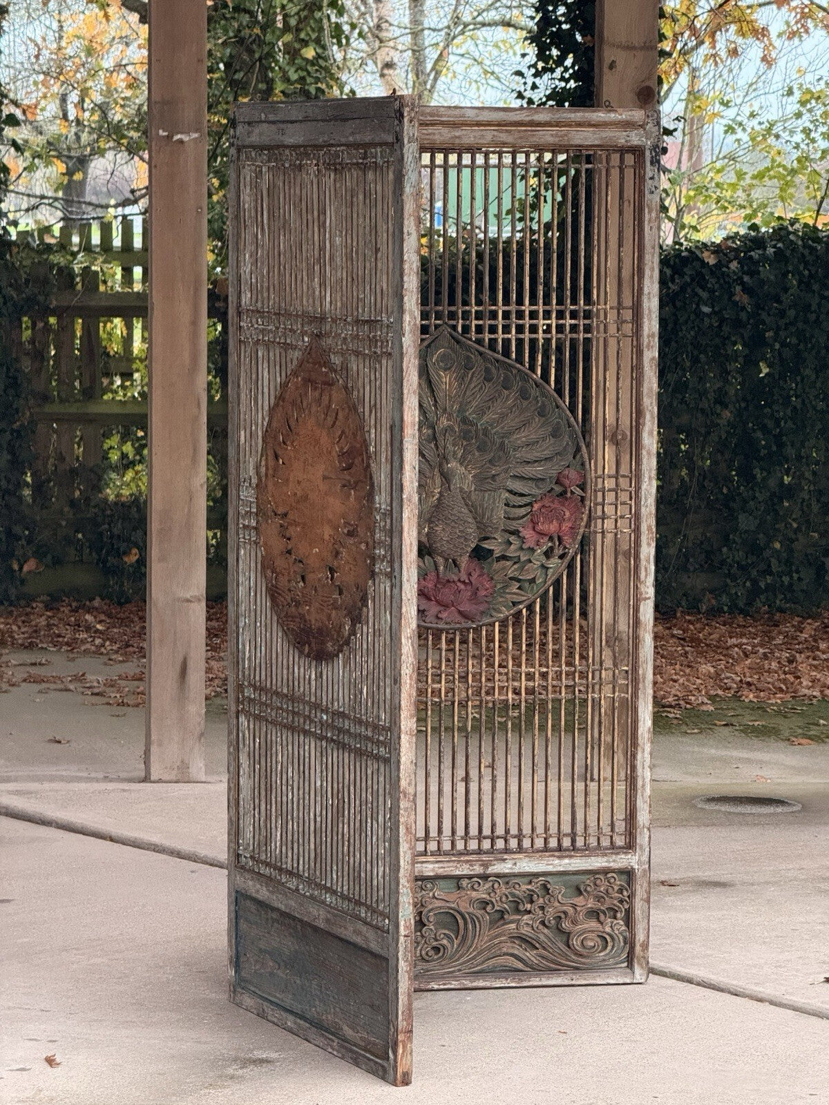 Carved peacock lattice screen, folded side view