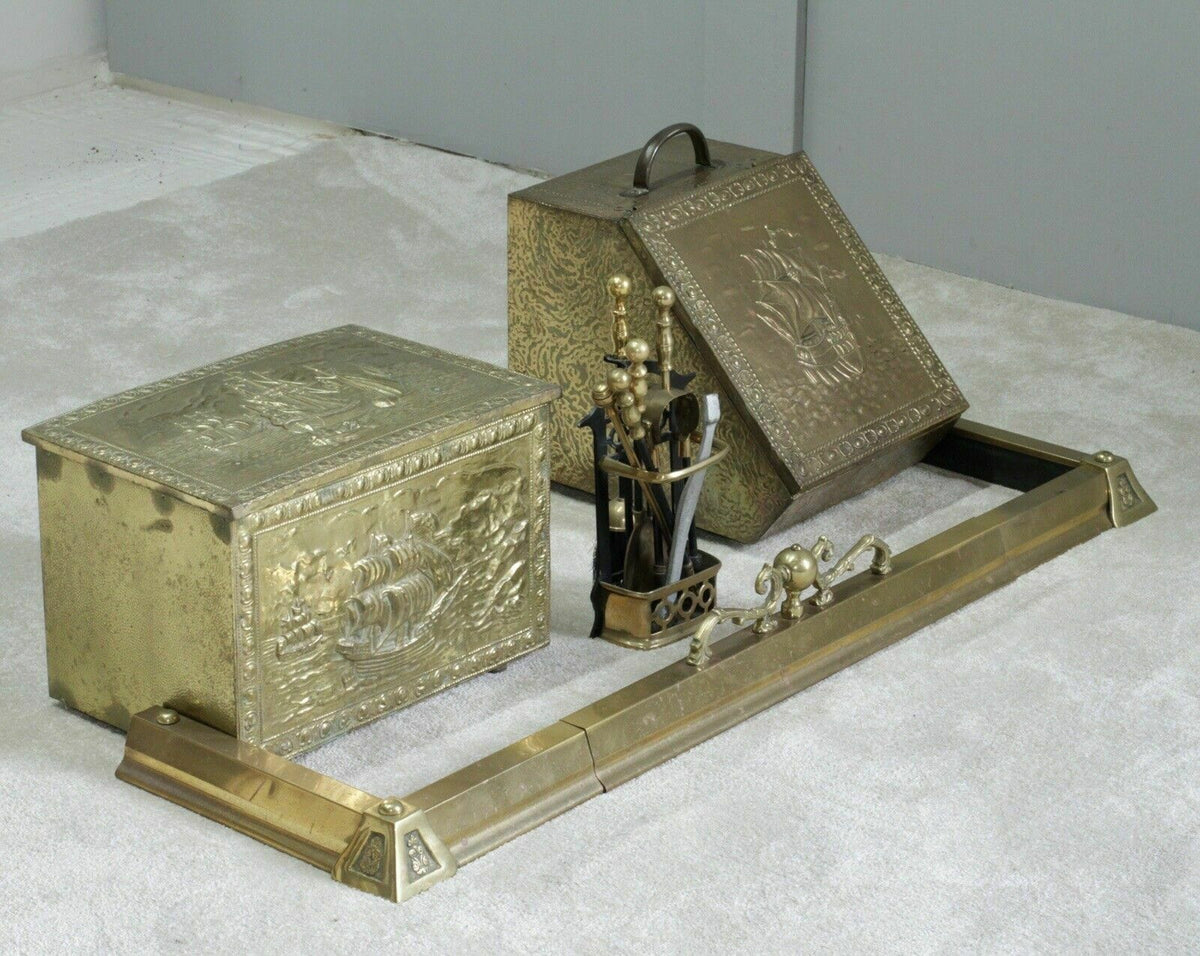 Brass fireplace fender with coal box and fire tools, styled view