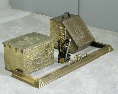 Brass fireplace fender with coal box and fire tools, styled view