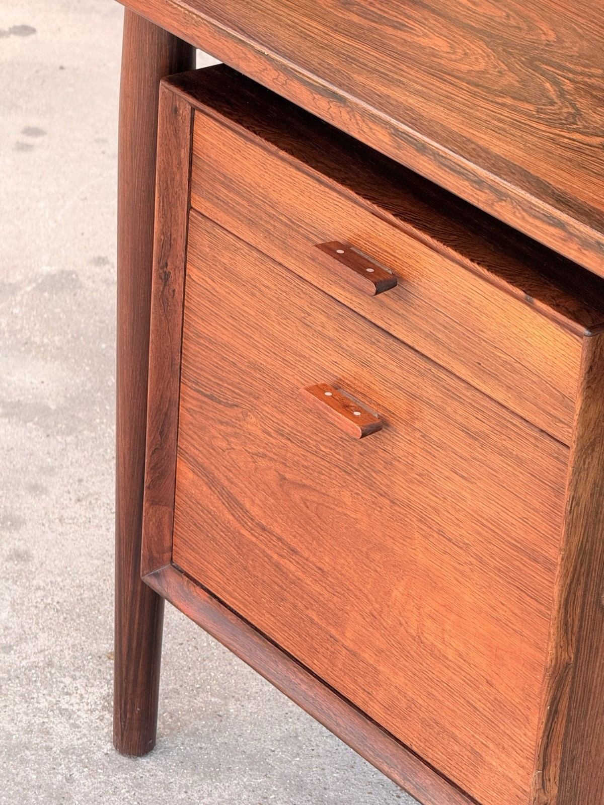 Close-up of rosewood drawers and recessed handles, Arne Vodder desk