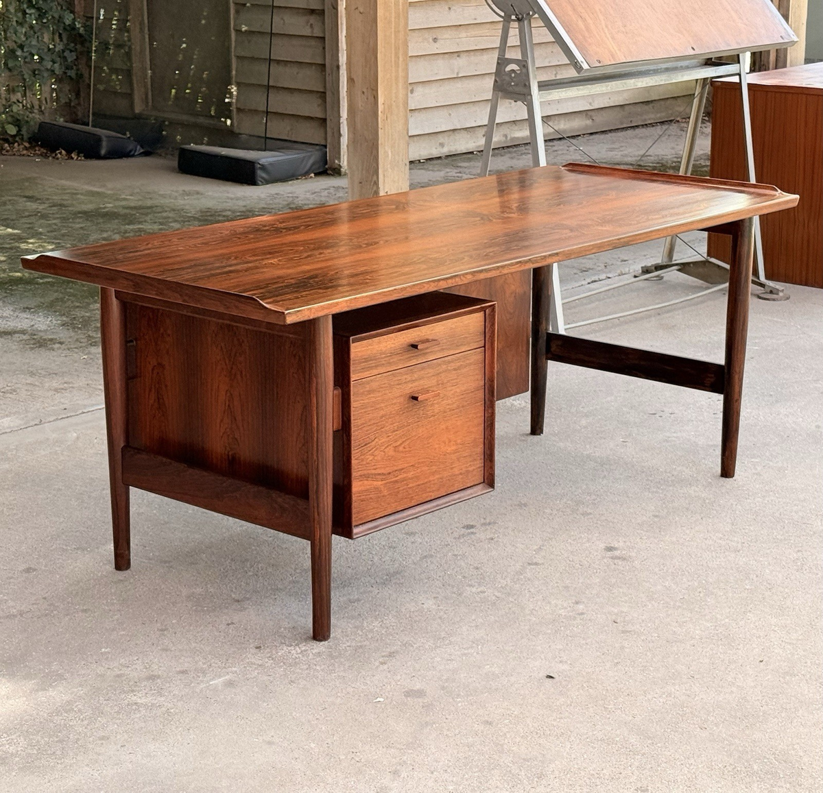 Arne Vodder rosewood desk, three-quarter view outdoors