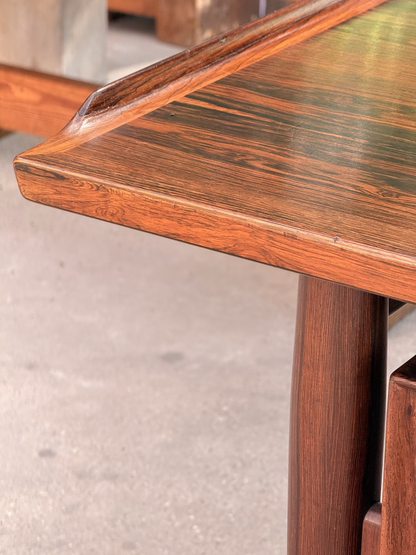 Close-up of raised sculpted edge on the rosewood desk top