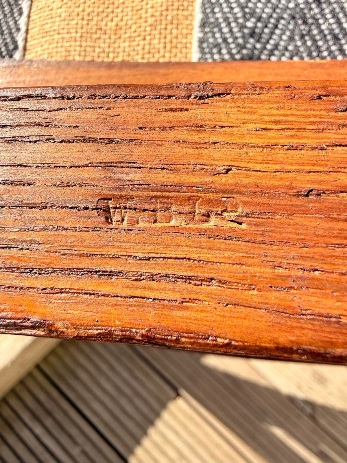 Impressed W.B.L.R. stamp on the oak frame of an Edwardian Arts & Crafts armchair
