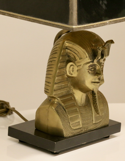Close-up of brass pharaoh bust, right side view