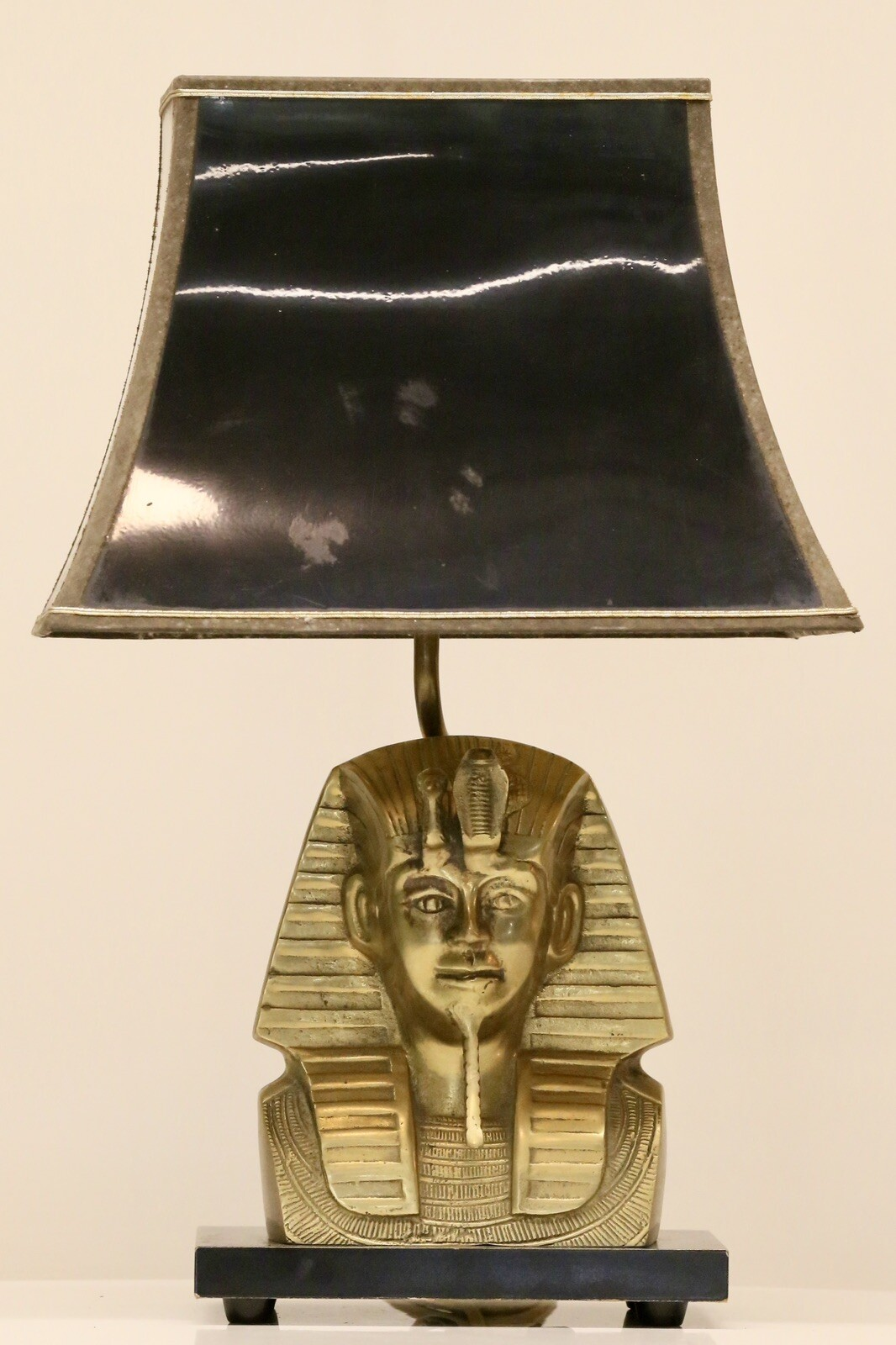 Belgian Hollywood Regency brass pharaoh bust table lamp with black pagoda shade on a black base