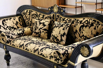 Close-up of black and gold damask cushions on the Regency couch