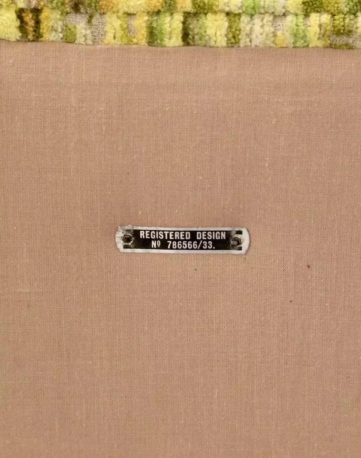 Close-up of registered design plate on the Relyon ottoman
