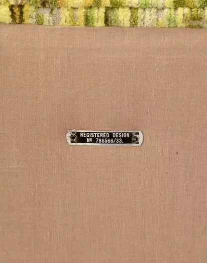 Close-up of registered design plate on the Relyon ottoman