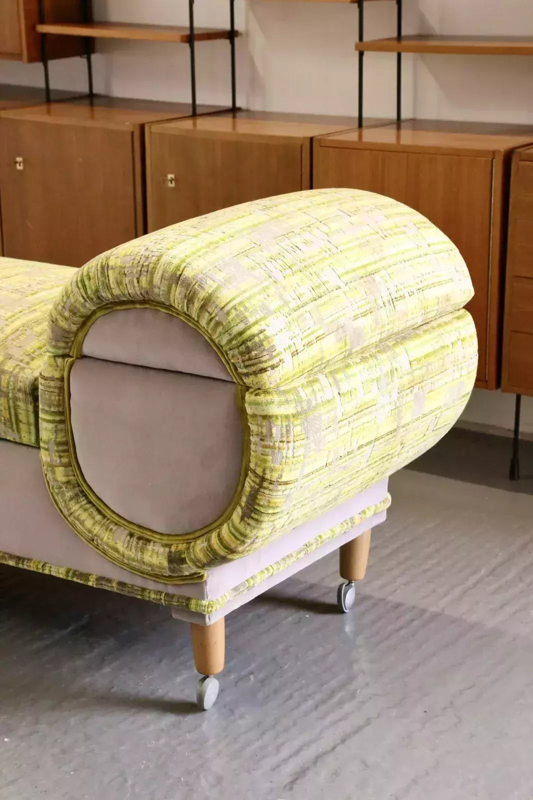Close-up of rolled end and castor leg, Relyon ottoman