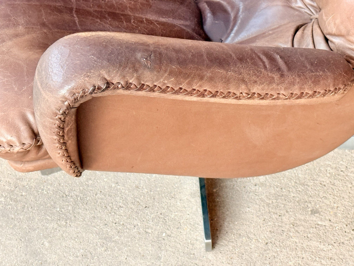 Close-up of stitched leather armrest edge, De Sede chair