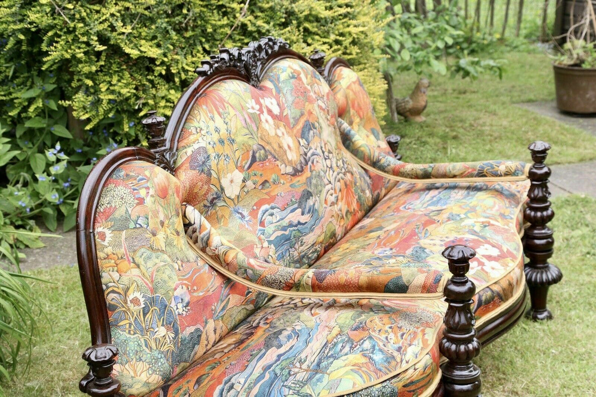 Victorian rosewood conversation seat, three-quarter view outdoors