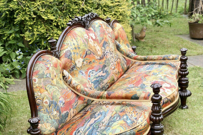 Victorian rosewood conversation seat, three-quarter view outdoors