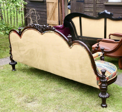 Back view of the Victorian rosewood conversation seat showing plain upholstered back