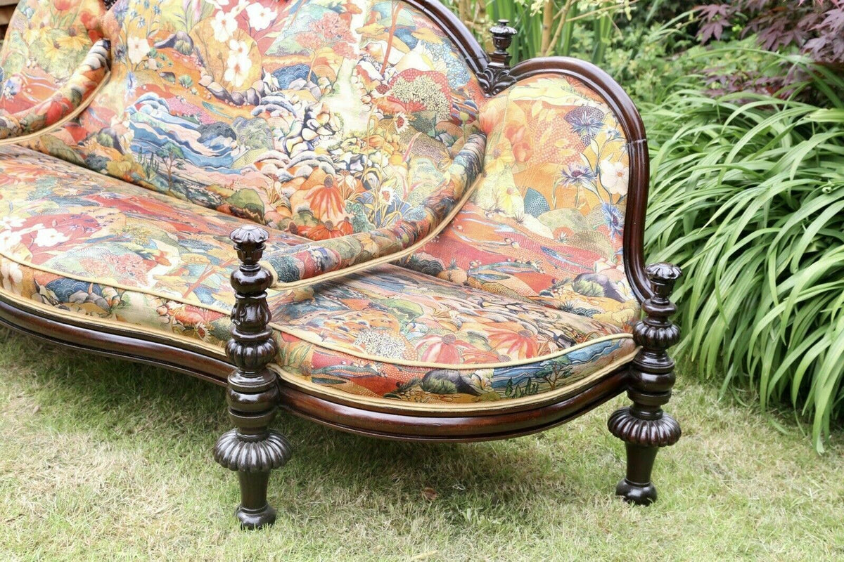 Close-up of turned rosewood legs on the conversation seat