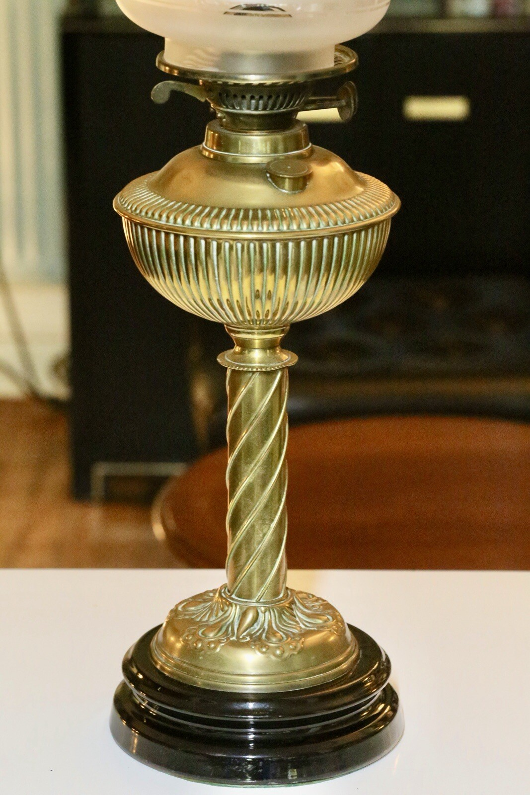 Close-up of reeded brass font and twisted column