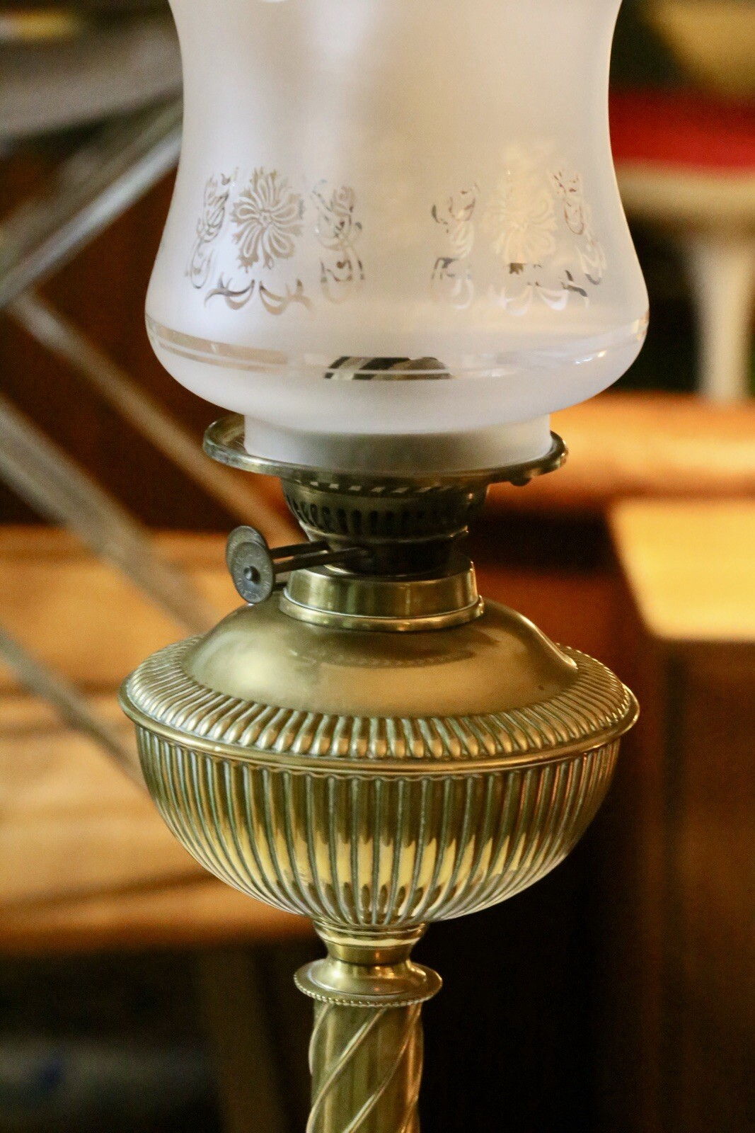 Close-up of burner and reeded brass reservoir