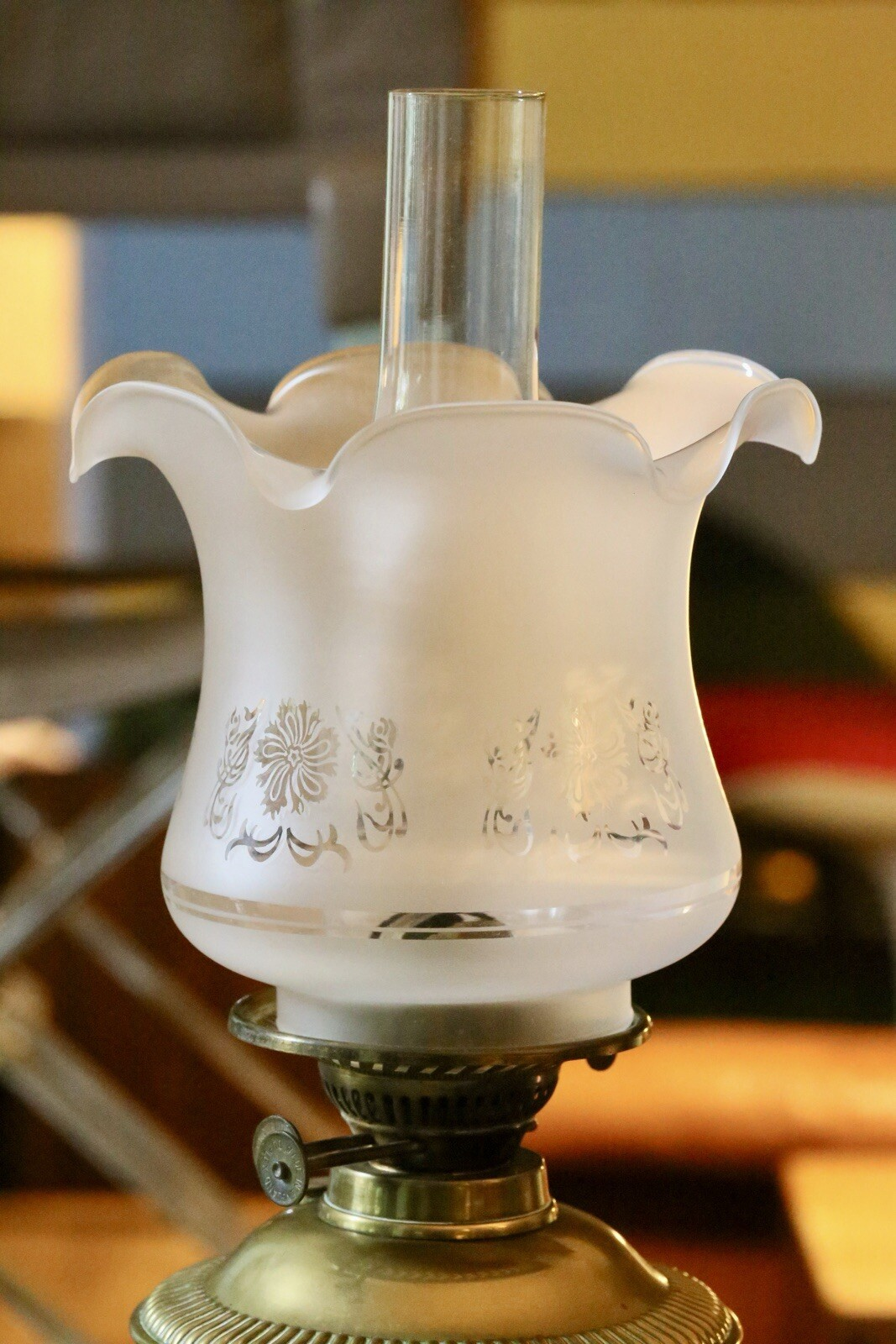 Close-up of etched frosted glass tulip shade and burner