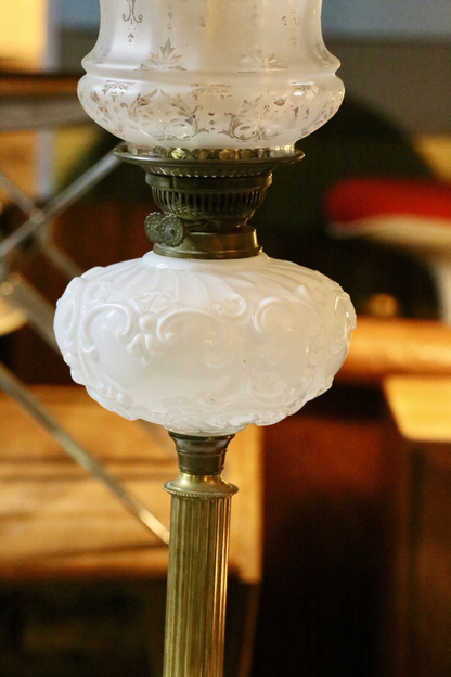 Close-up of milk glass reservoir and burner collar