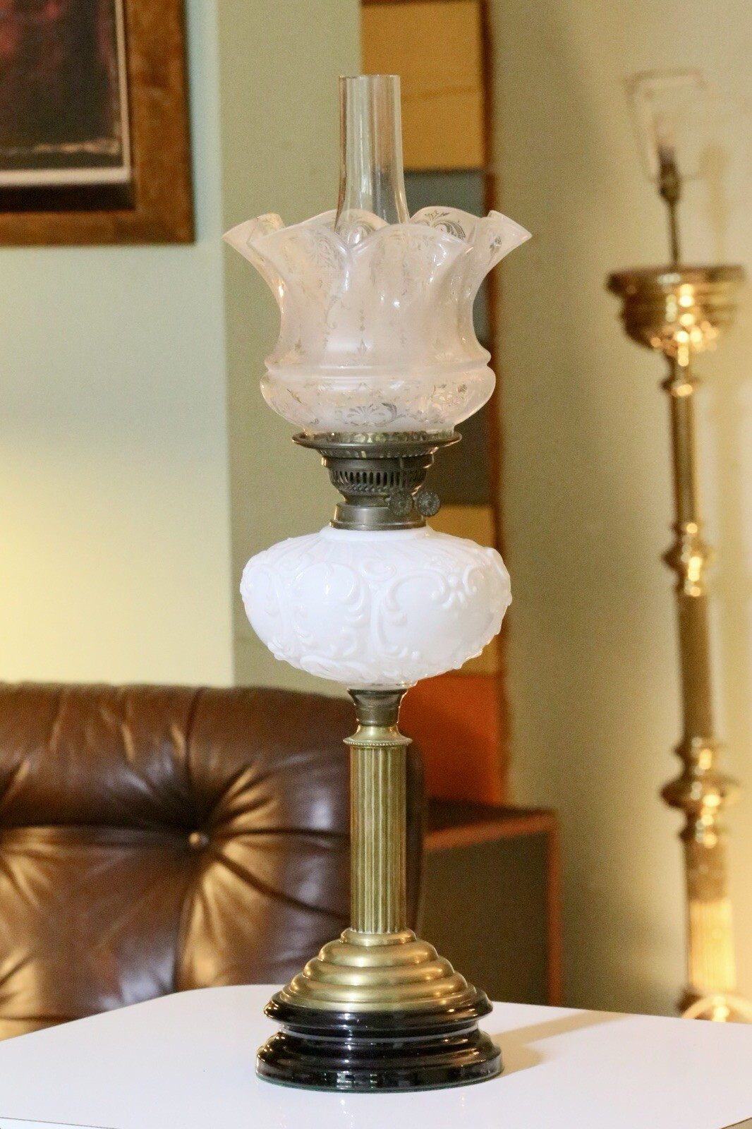 Victorian brass oil lamp with milk glass reservoir, front view