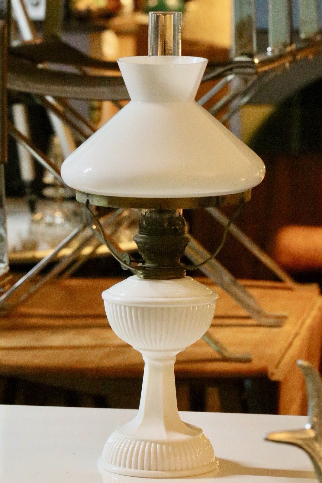 Art Deco brass and milk glass oil lamp, angled view