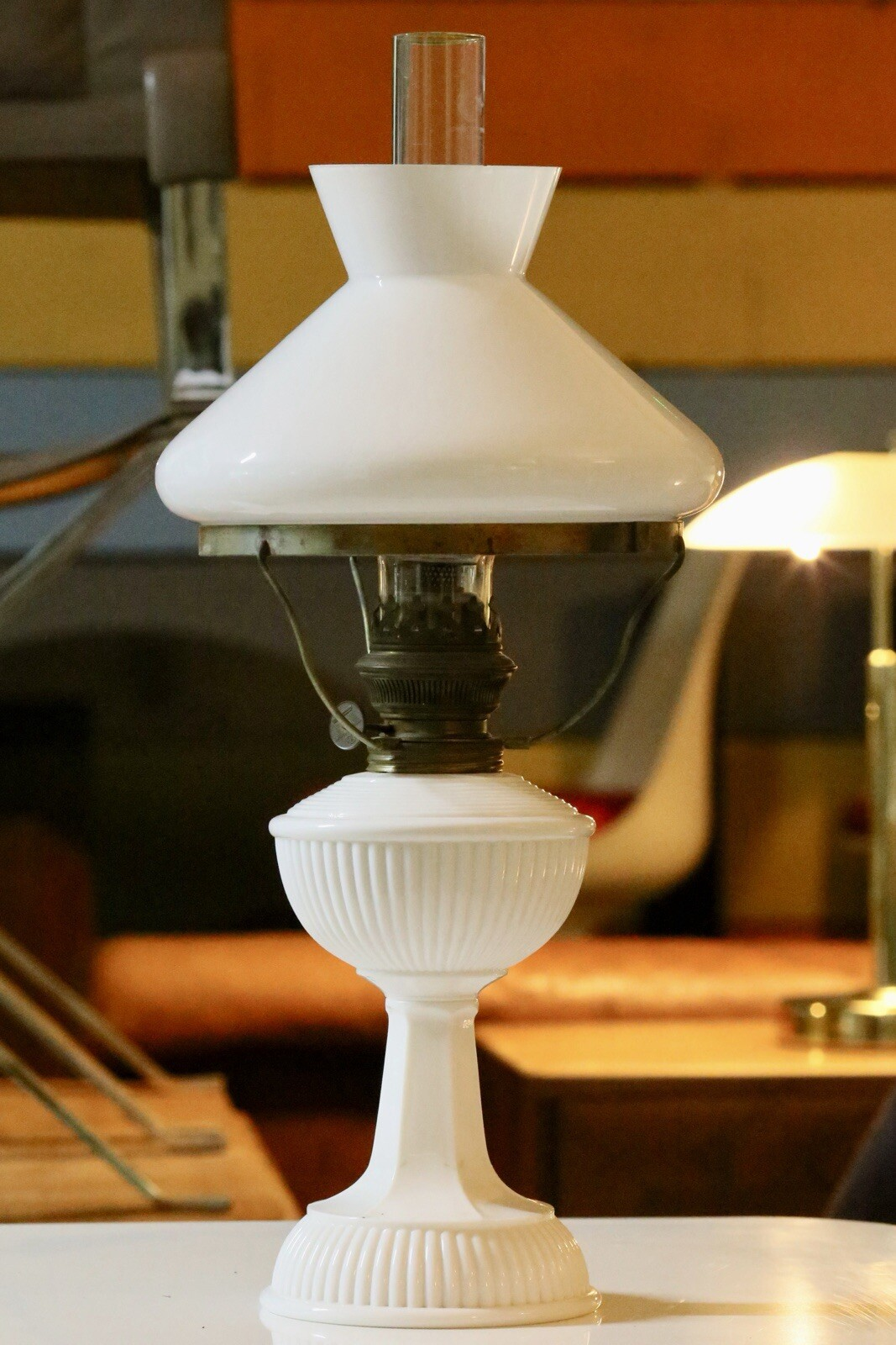 Art Deco brass and milk glass oil lamp, three-quarter view
