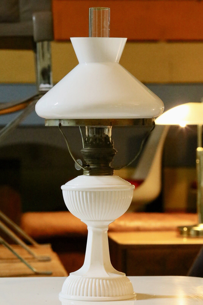 Art Deco brass and milk glass oil lamp, three-quarter view