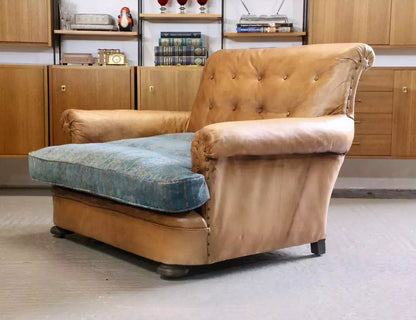 French Art Deco style brown leather loveseat armchair, three-quarter view