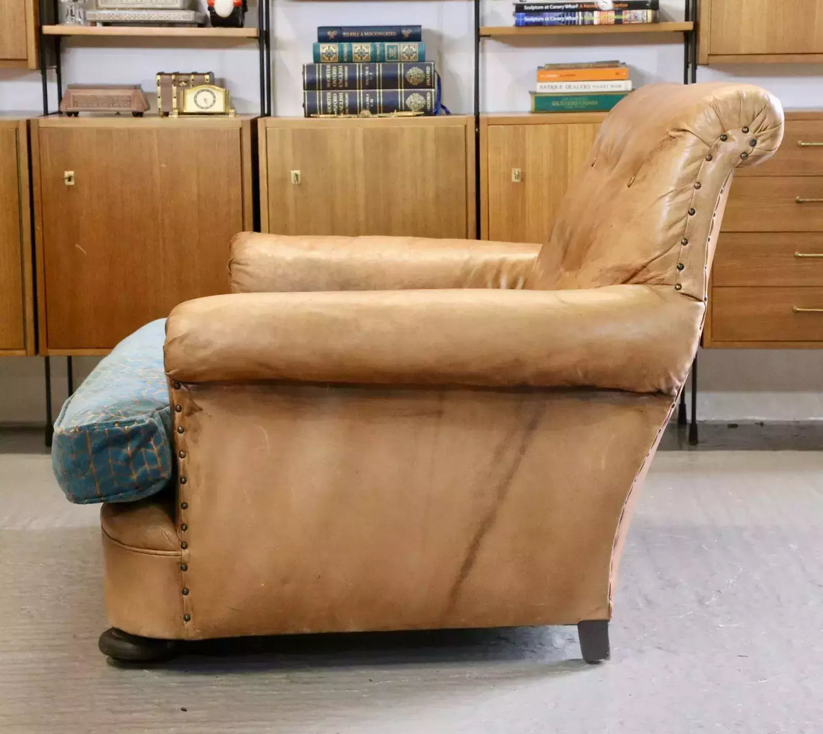 Side profile of the brown leather loveseat armchair