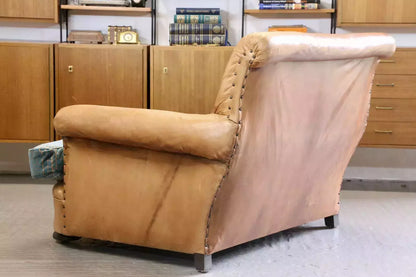 Back view of the French Art Deco style brown leather loveseat armchair